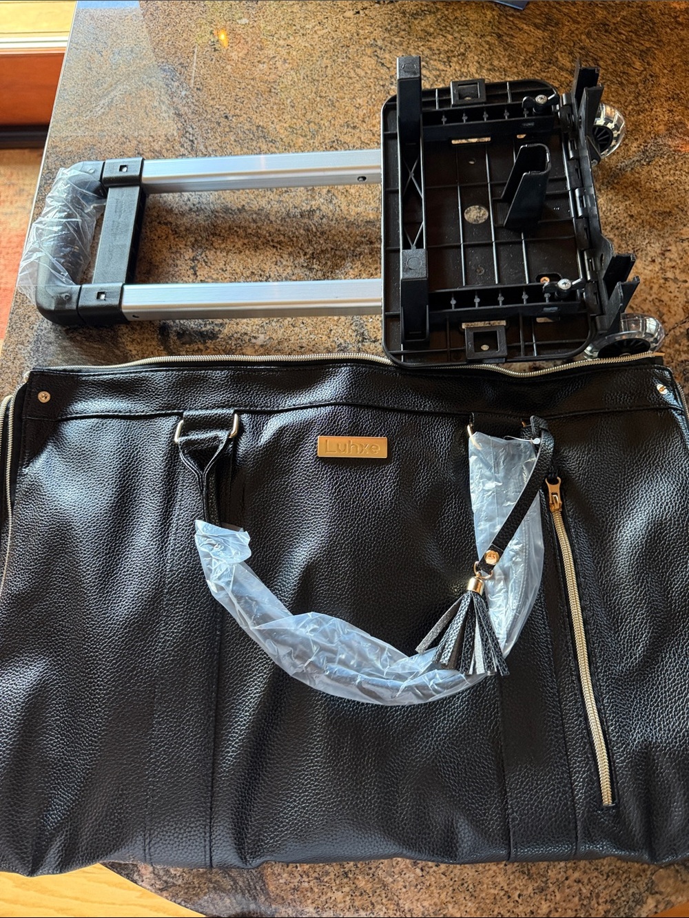 Black Rolling Travel Duffel with Tassel Accent